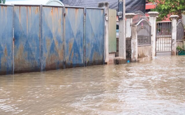 Unusually high sea levels caused water to flood roads in residential communities next to the river
