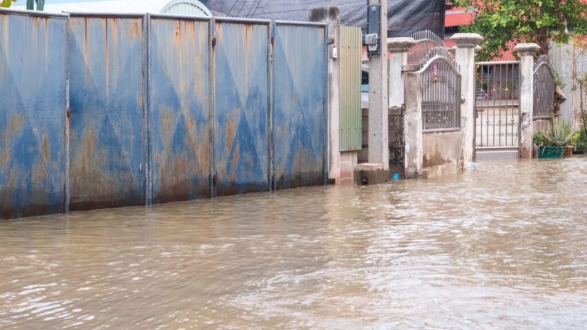 Unusually high sea levels caused water to flood roads in residential communities next to the river